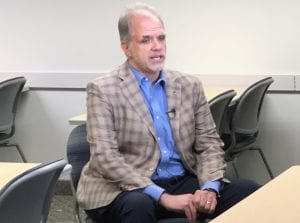 Matthew Dietz, in a tan checkered blazer, blue shirt and navy pants